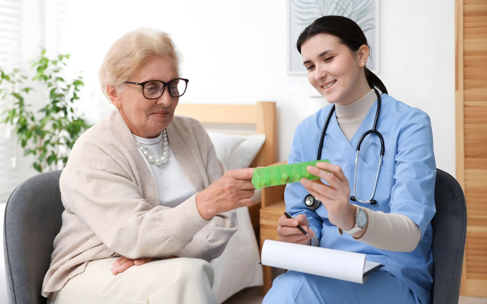 Personal support worker helping a senior with daily routine at home in Ontario