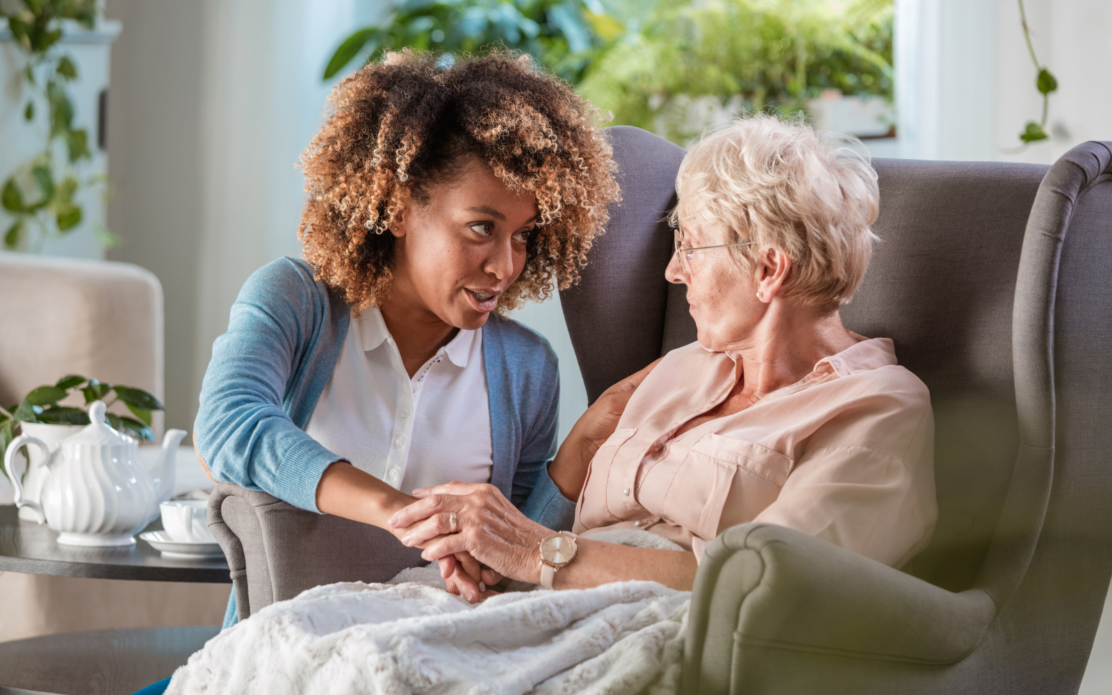 Caregiver providing safe mobility support to a senior navigating their home in Ontario